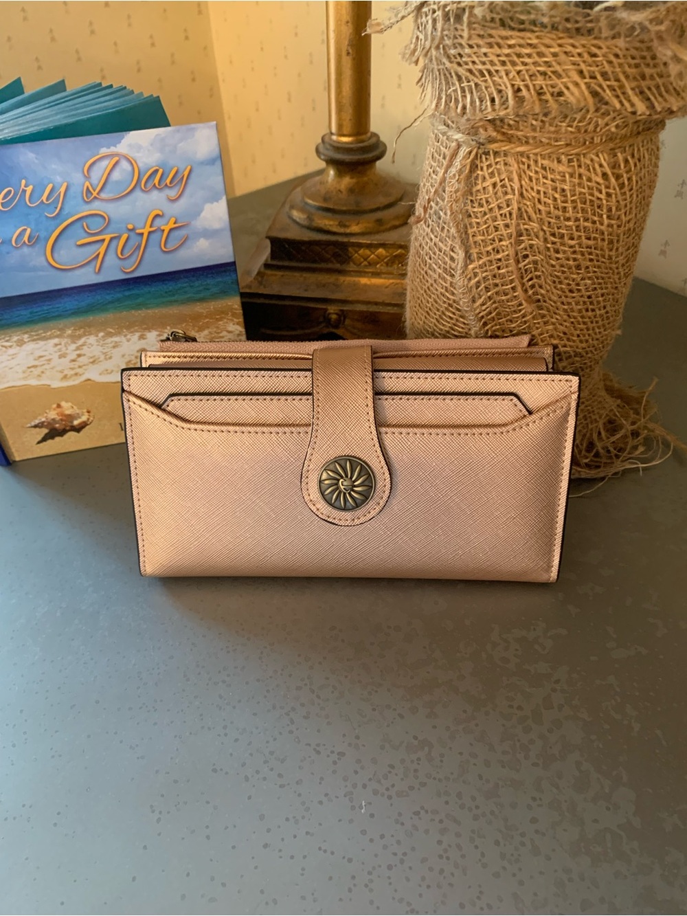 Travelambo, NEW NEVER CARRIED, ROSE GOLD triple fold RFID blocking wallet.